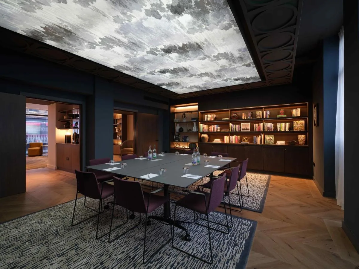 a dining room with a long table and chairs at The Resident Edinburgh in Edinburgh