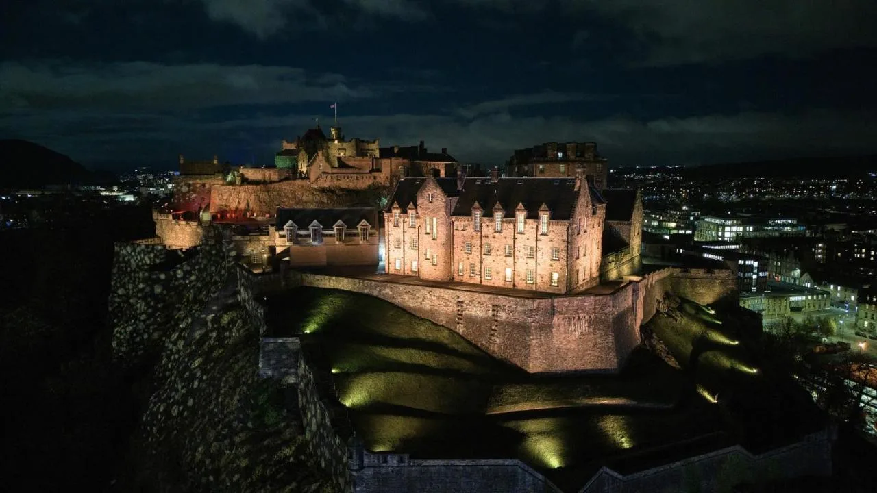 a castle at night with its lights on at The Resident Edinburgh in Edinburgh