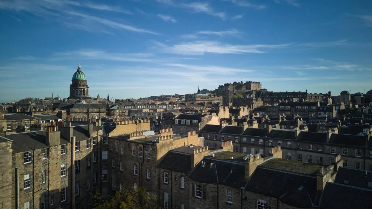 a view of the city of edinburgh with buildings at The Resident Edinburgh in Edinburgh